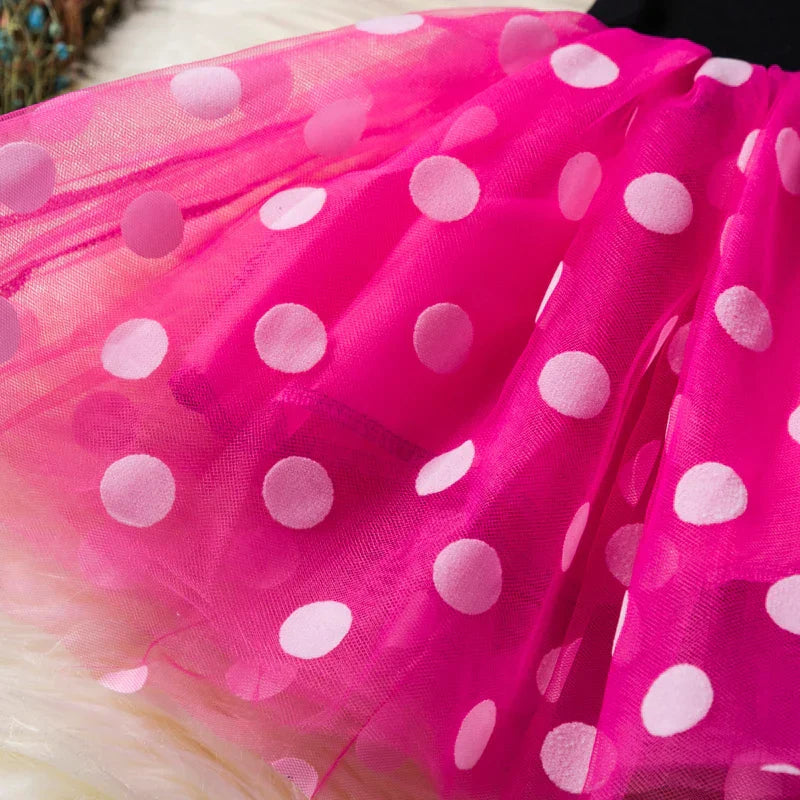 Complete Minnie Mouse costume for girls, with a charming red polkadot dress and a signature bow headband.