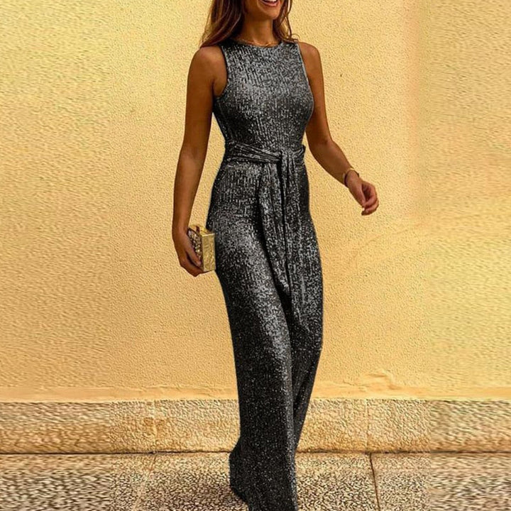 Shiny women's V-neck wide-leg jumpsuit, a glamorous festive party outfit. Elegant evening wear for celebrations.