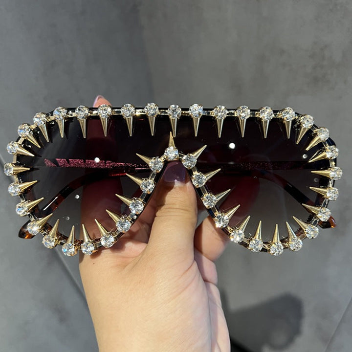 Glamorous women's glitter cat-eye sunglasses with UV protection. Stylish fashion accessory for eye protection.