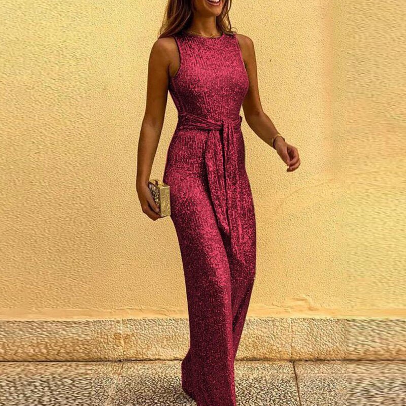 Elegant women's gold sequin jumpsuit with a flowing wide-leg and chic waist tie, ideal for special occasions.