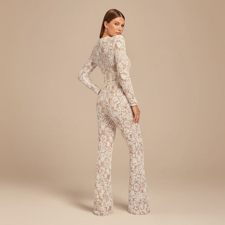 Glamorous women's jumpsuit, perfect for special occasions. Features long sleeves, wide leg, defined waist.