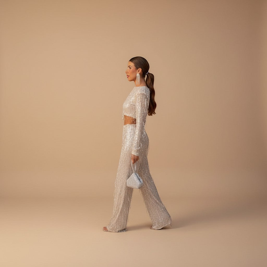 Sparkling women's sequin crop top and matching wide leg pants, a chic two-piece evening set.
