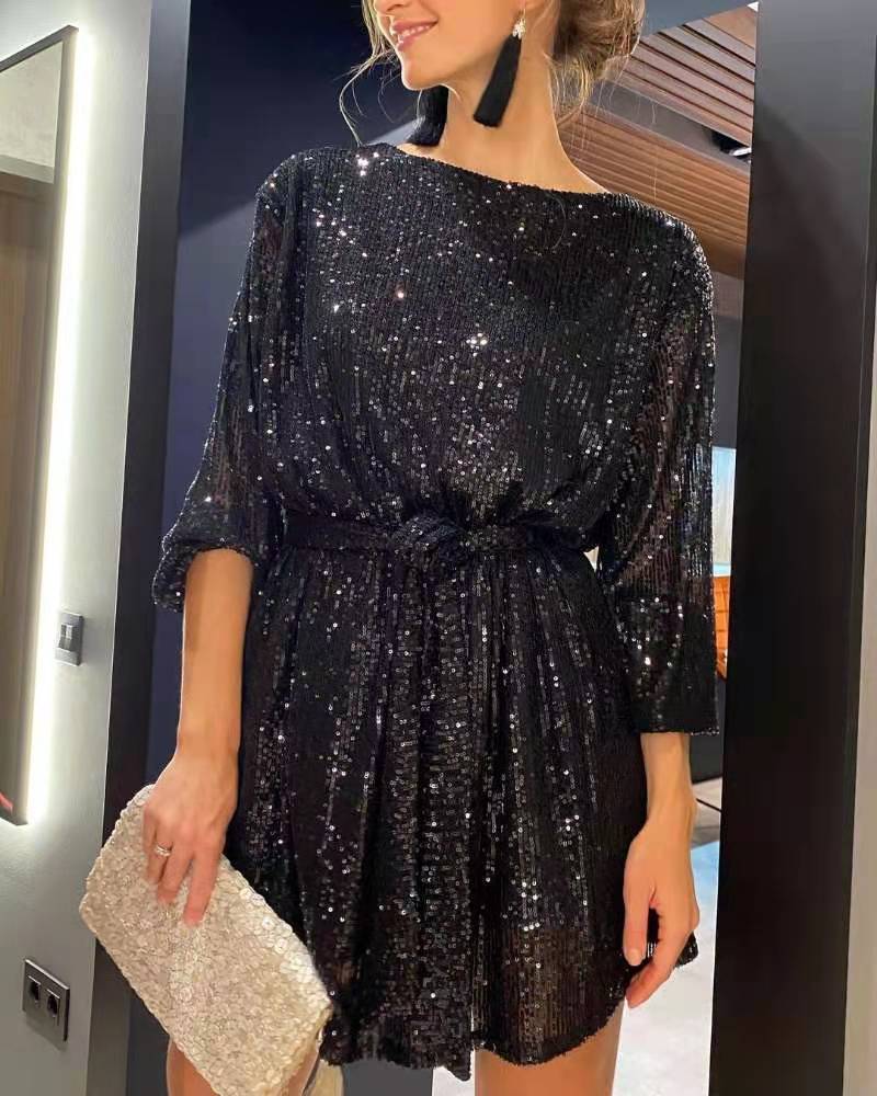 Model wearing a glamorous women's sequin mini cocktail dress, perfect for evening parties & celebrations.