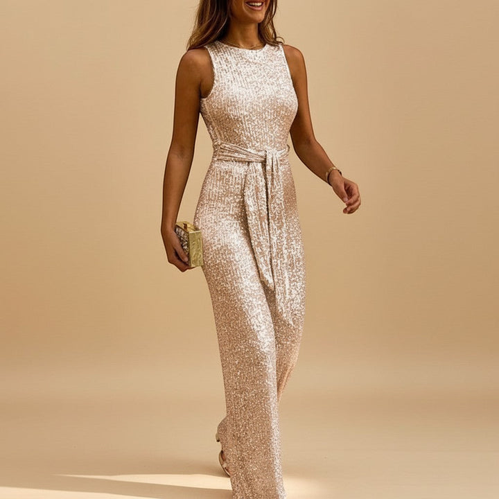Sparkling sequin wide-leg jumpsuit for women. Features a flattering waist tie, ideal for special occasions.