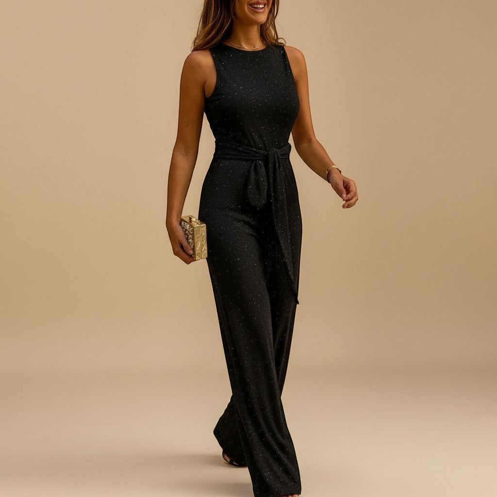 Shimmering women's sequin wide-leg jumpsuit. An elegant one-piece with waist tie, ideal for glamorous parties.