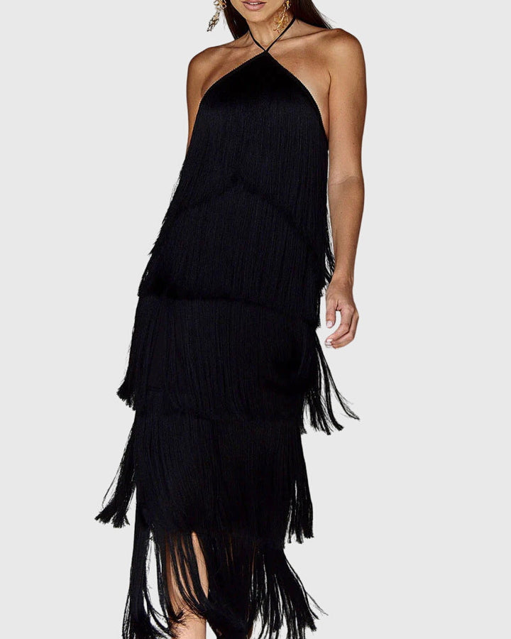 Fashionable women's party dress with a daring open back, halter neck, and decorative tassels.