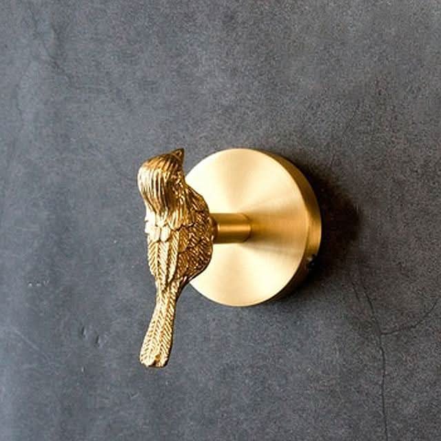 Gold brass animal wall hook. Decorative, nature-inspired design for entryway or bathroom organization.