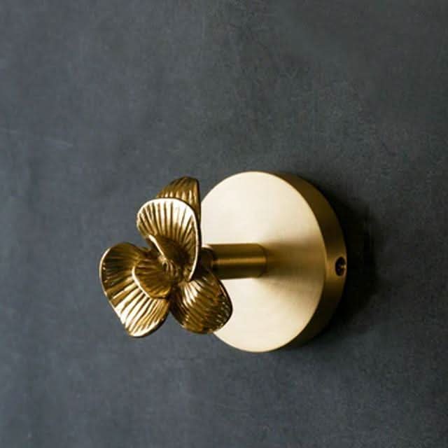 Elegant gold brass animal wall hook. Functional & decorative for unique home organization and wall art.