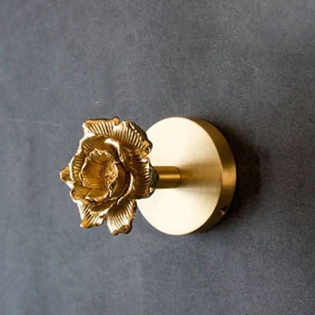 Durable gold brass animal wall hook. Perfect for unique entryway storage, bathroom towels, or decorative display.
