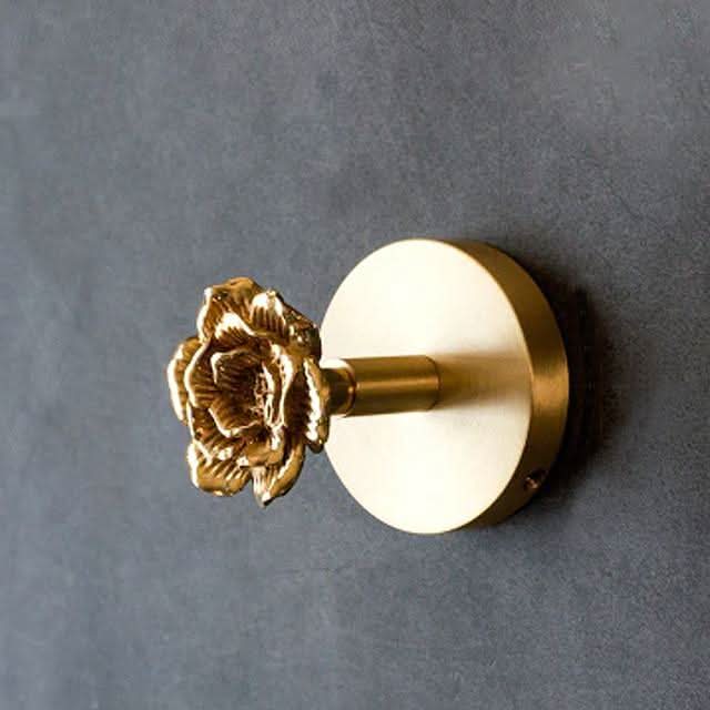 Chic nature-inspired gold brass animal wall hook. Great for hanging coats, towels, or as standalone decor.