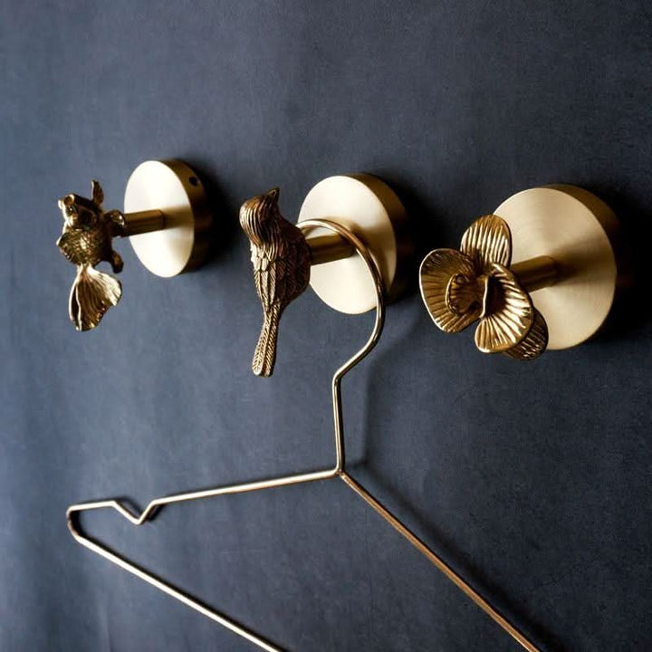 Elegant gold brass animal wall hook. Perfect for coat racks, entryway decor, or bathroom accessories.