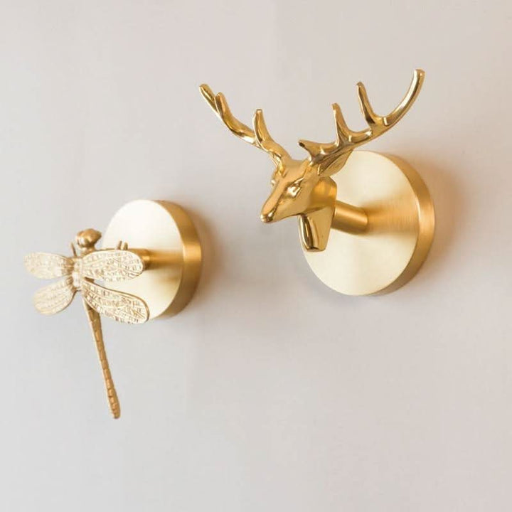 Stylish brass animal wall hook with gold finish. Ideal for home organization & decorative entryway display.