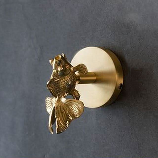 Gold brass animal wall hook. A decorative solution for coat racks, robes, and versatile home organization.