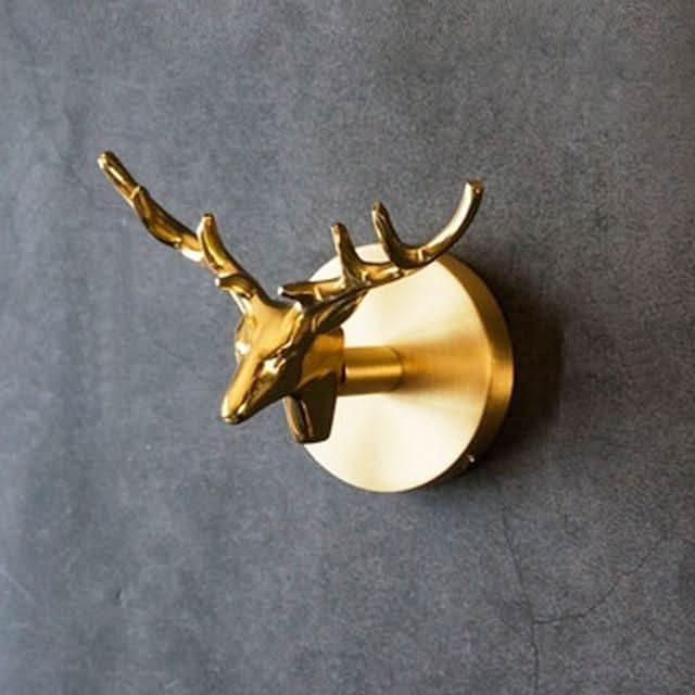 Luxurious gold finish brass animal wall hook. Elevates home decor while providing practical wall storage.