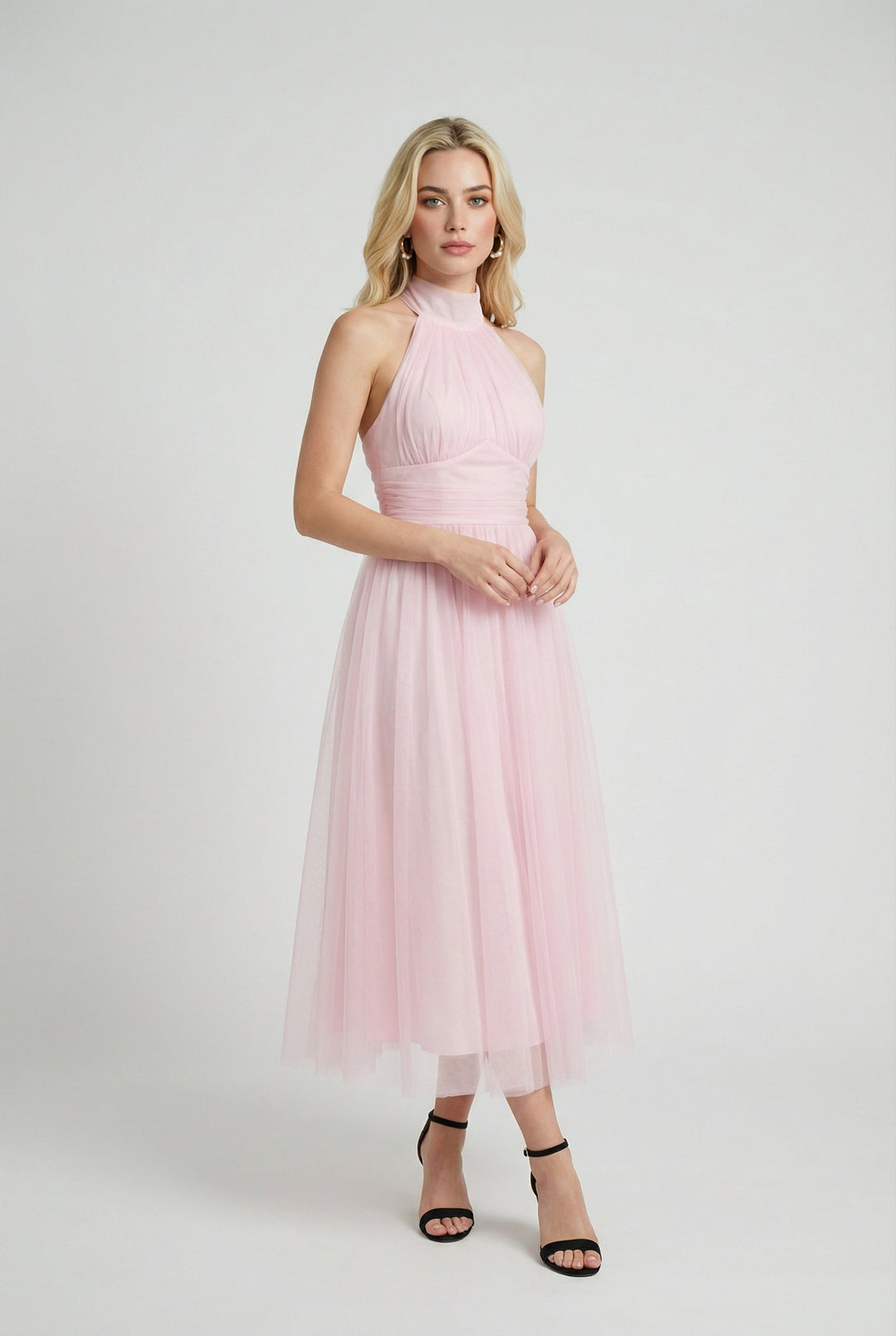 Graceful blush pink halter midi dress for women, perfect for parties and evening events.