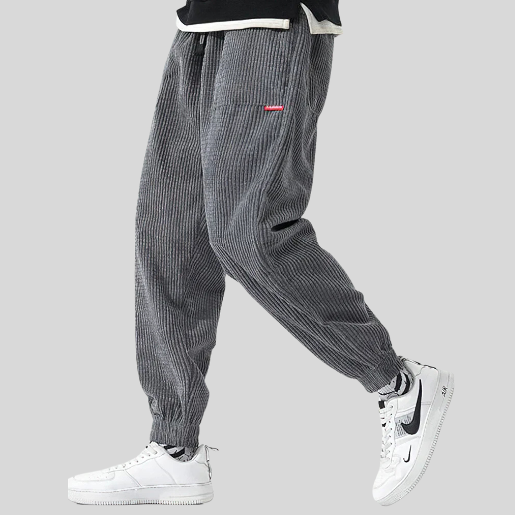 Gray men's wide corduroy joggers, relaxed fit, perfect for casual everyday wear. Comfortable and stylish.