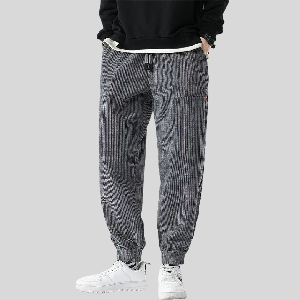 Men's relaxed fit corduroy joggers with wide legs, perfect casual pants for comfortable everyday style. Available in gray.