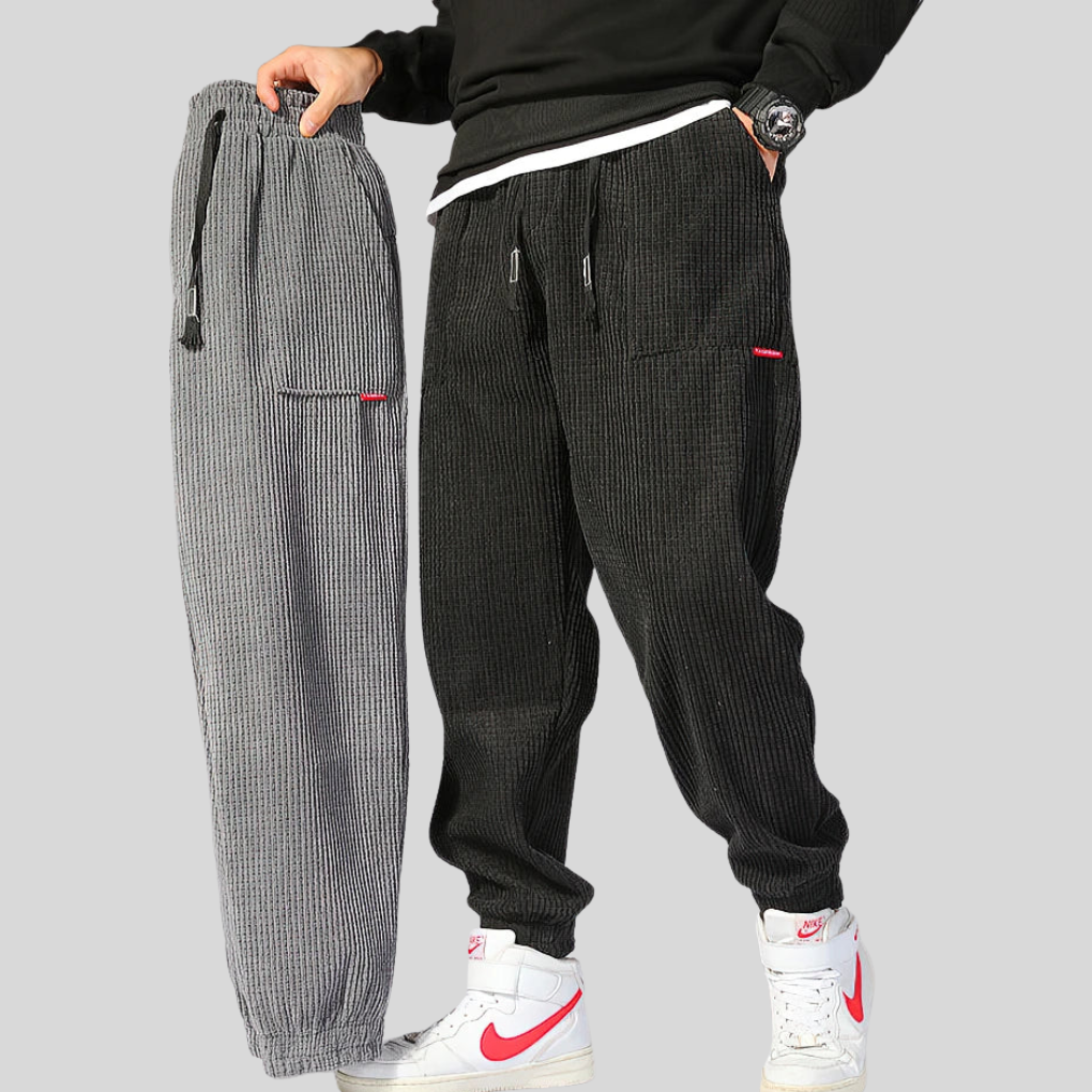 Versatile men's wide corduroy joggers in black, offering a relaxed fit and ultimate comfort for daily casual wear.