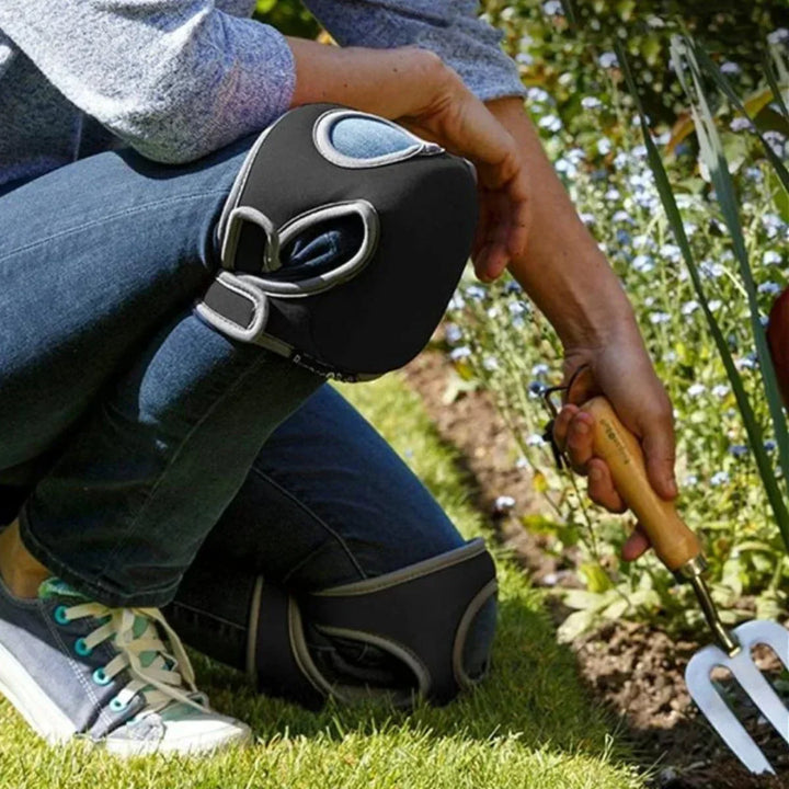 Gardener wearing green ergonomic knee pads, kneeling comfortably for planting with superior knee protection.