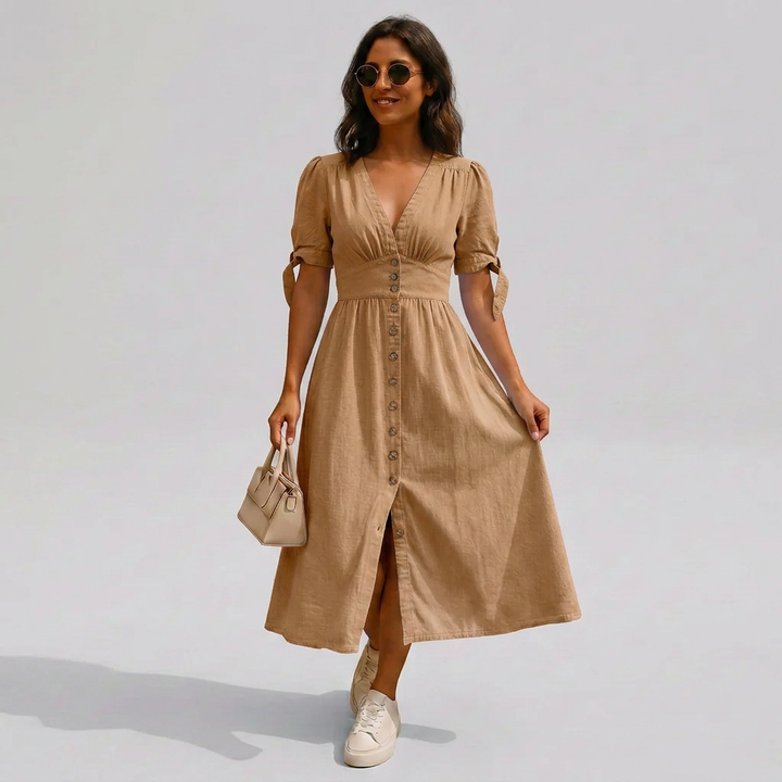 Versatile women's v-neck button-front midi dress with tie-sleeves, ideal as a casual or elegant summer dress.