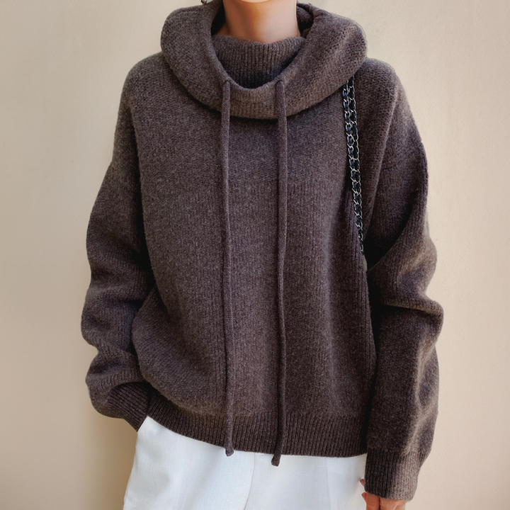 Comfortable women's pullover hoodie featuring a relaxed fit & chic cowl neck. Versatile for casual & lounge wear.