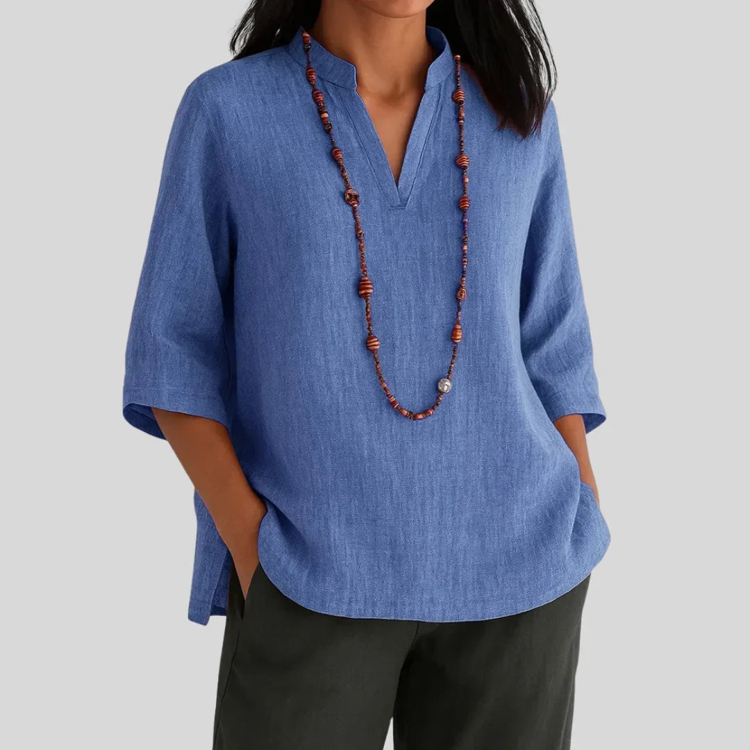 Blue women's versatile V-neck top, relaxed fit 3/4-sleeve blouse with side slits for everyday style.