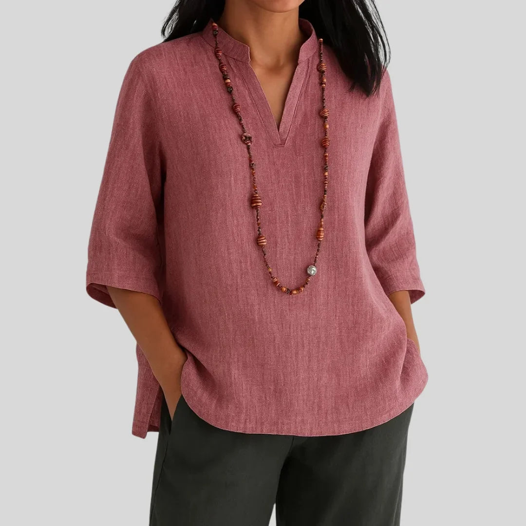 Red women's V-neck summer blouse, featuring a relaxed fit, 3/4 sleeves, and chic side slits for stylish comfort.