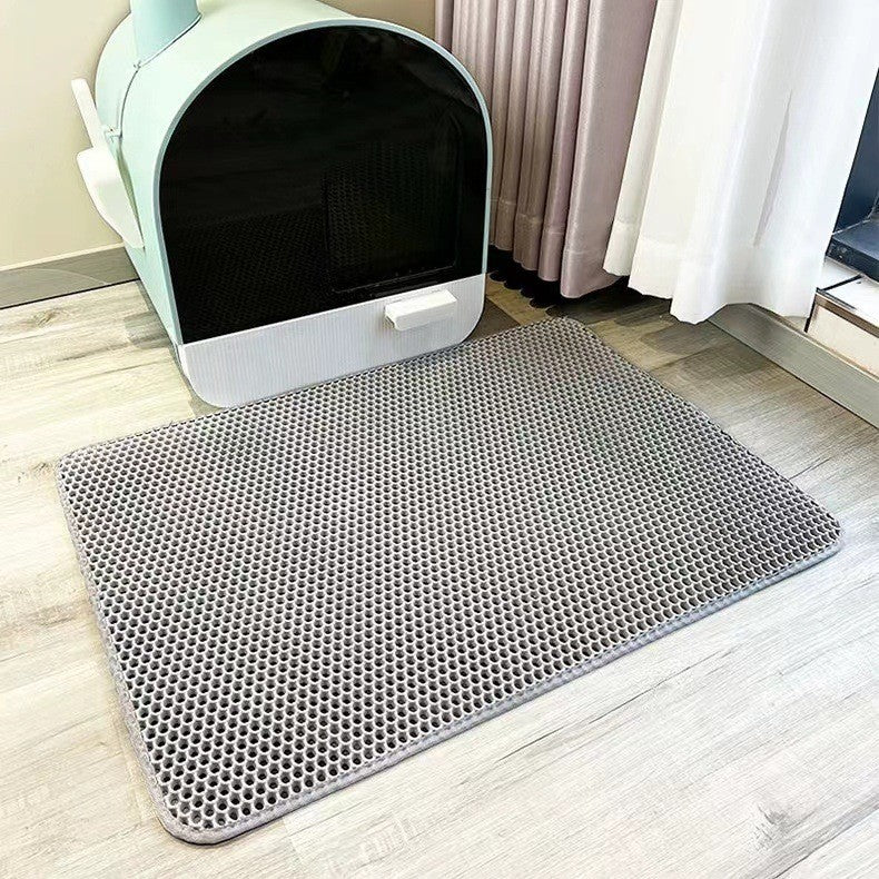 Honeycomb cat litter trapping mat, effectively collects scattered litter, ensuring clean paws & floors. Ideal pet mat solution.