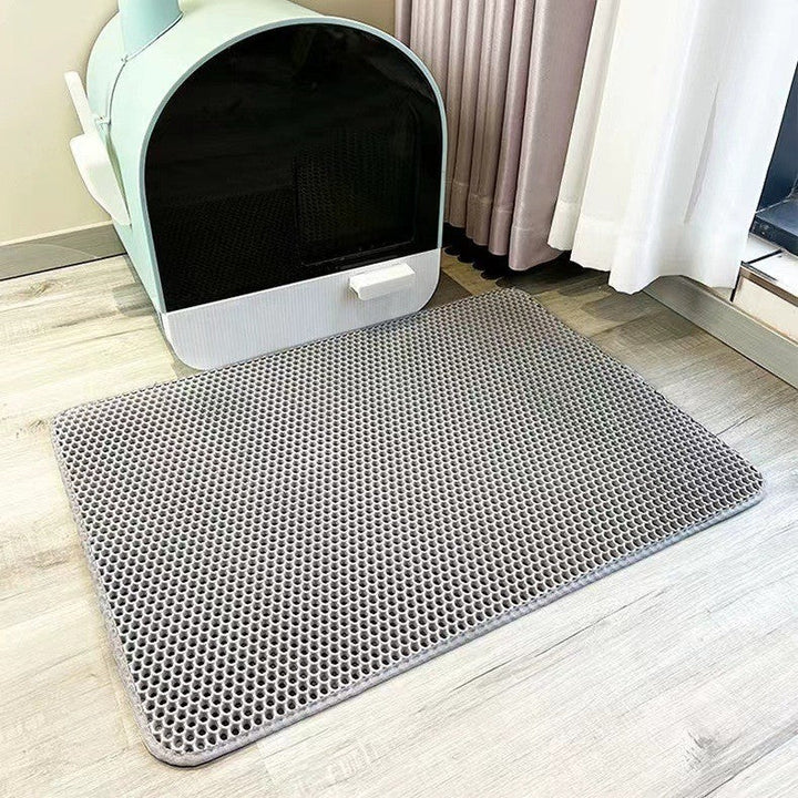 Honeycomb cat litter trapping mat, effectively collects scattered litter, ensuring clean paws & floors. Ideal pet mat solution.