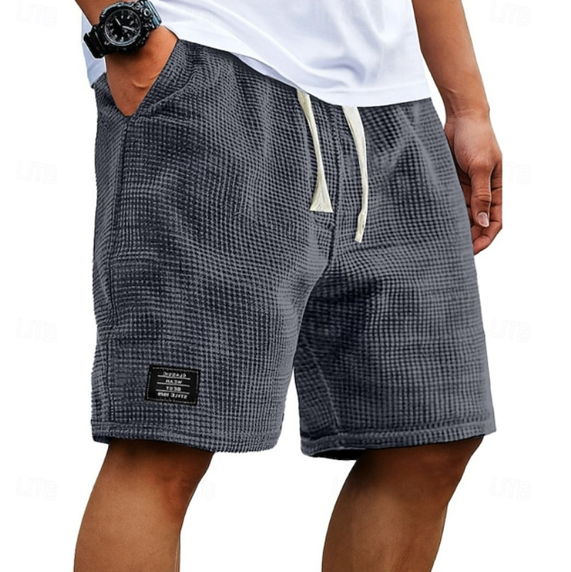 Grey men's casual summer shorts with a relaxed fit, perfect for everyday comfort & breathability.