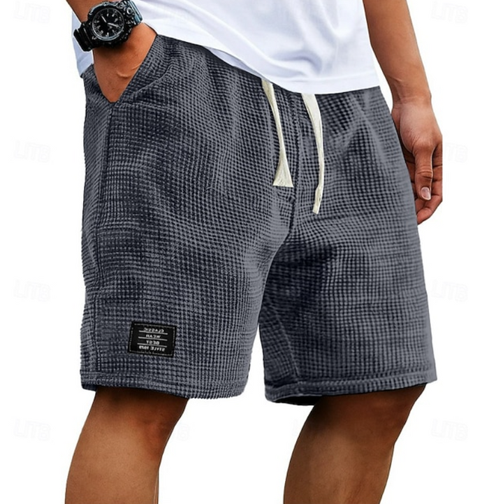 Grey men's casual summer shorts with a relaxed fit, perfect for everyday comfort & breathability.