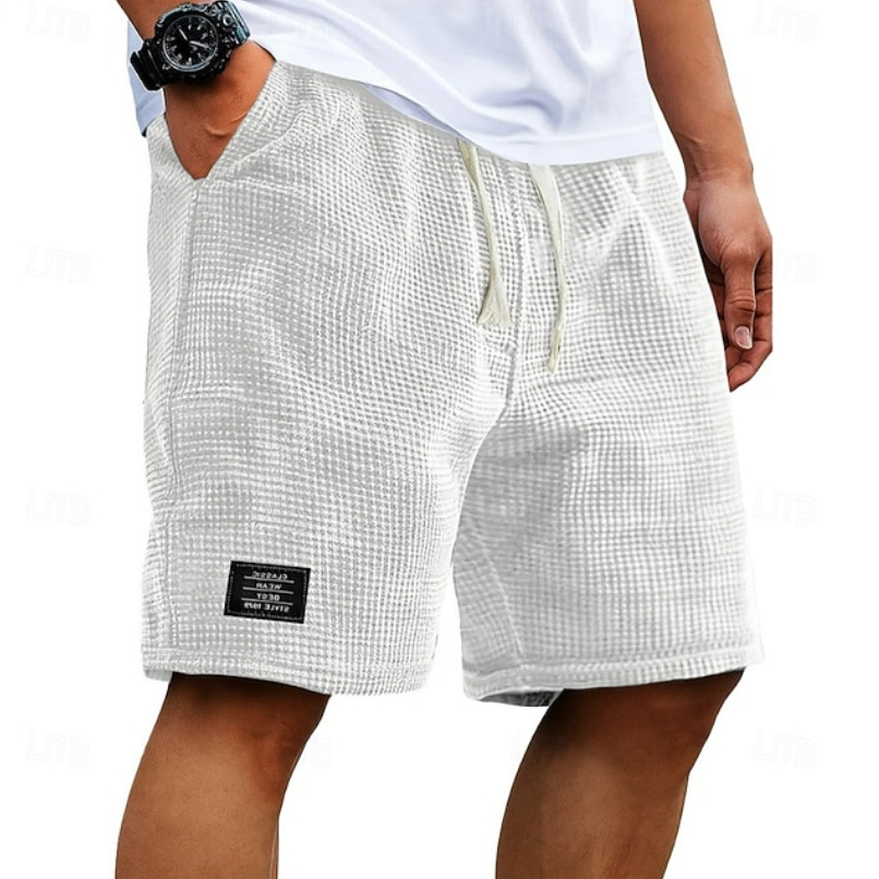 Close-up of breathable fabric on men's casual summer shorts, highlighting the comfortable, lightweight texture.