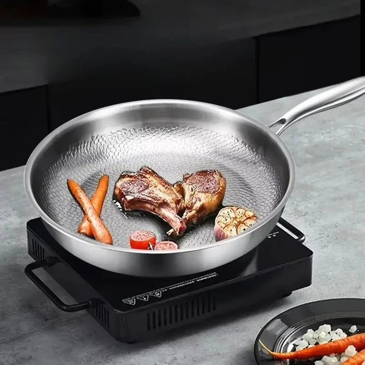 Premium hammered titanium skillet for induction. Ensures even heat distribution for cooking.