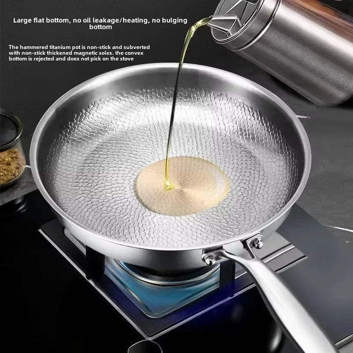 Heavy-duty hammered titanium induction skillet. Designed for superior and even cooking.