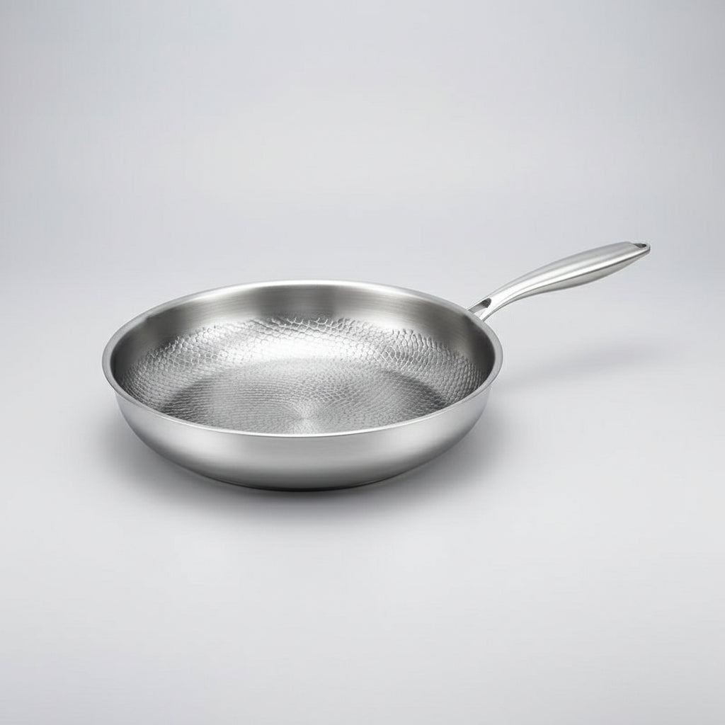 Modern hammered titanium frying pan, perfect for induction. Enhances any kitchen cooking.