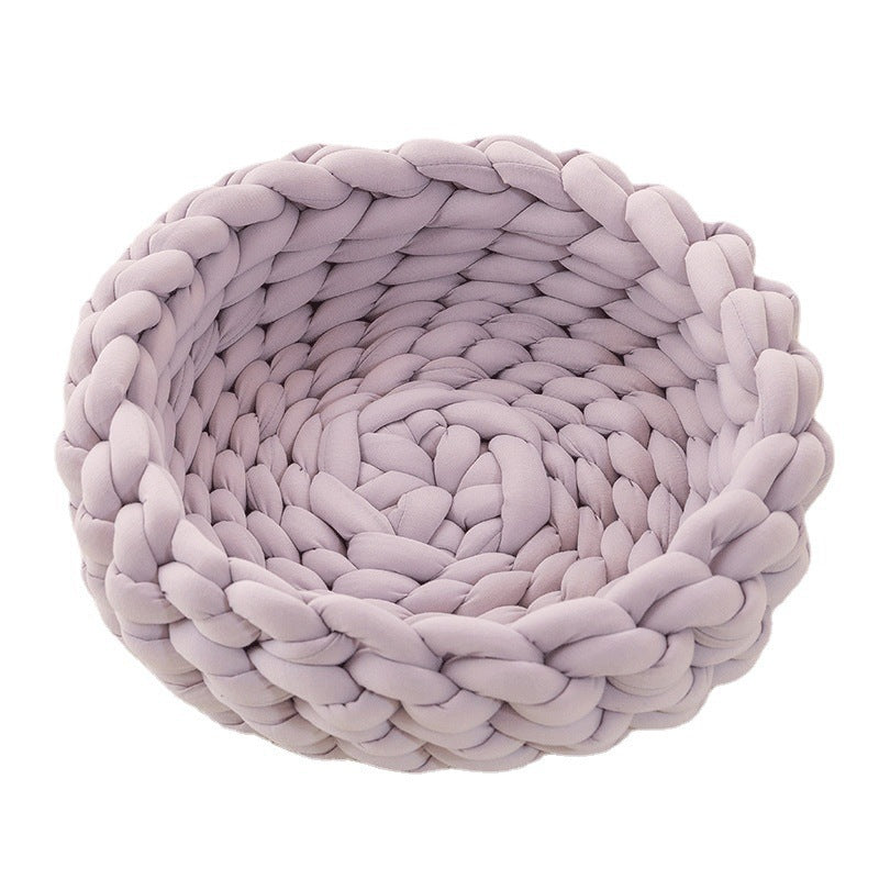 Stylish woven pet retreat, a handmade grey cat basket for discerning pets.