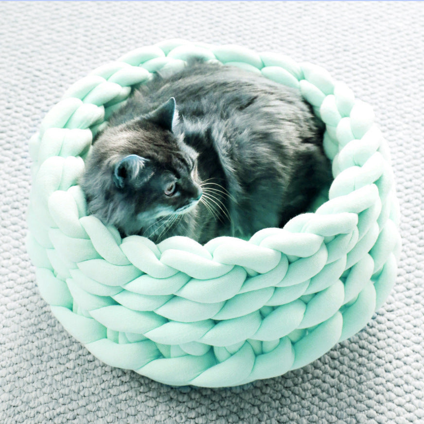 Stylish pet furniture: a durable, hand-woven cat bed in a modern grey color.