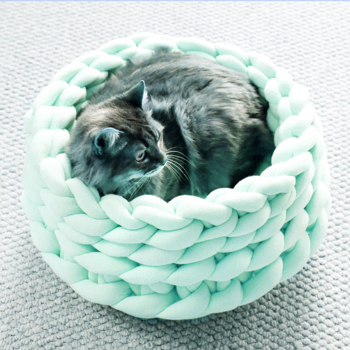 Stylish pet furniture: a durable, hand-woven cat bed in a modern grey color.