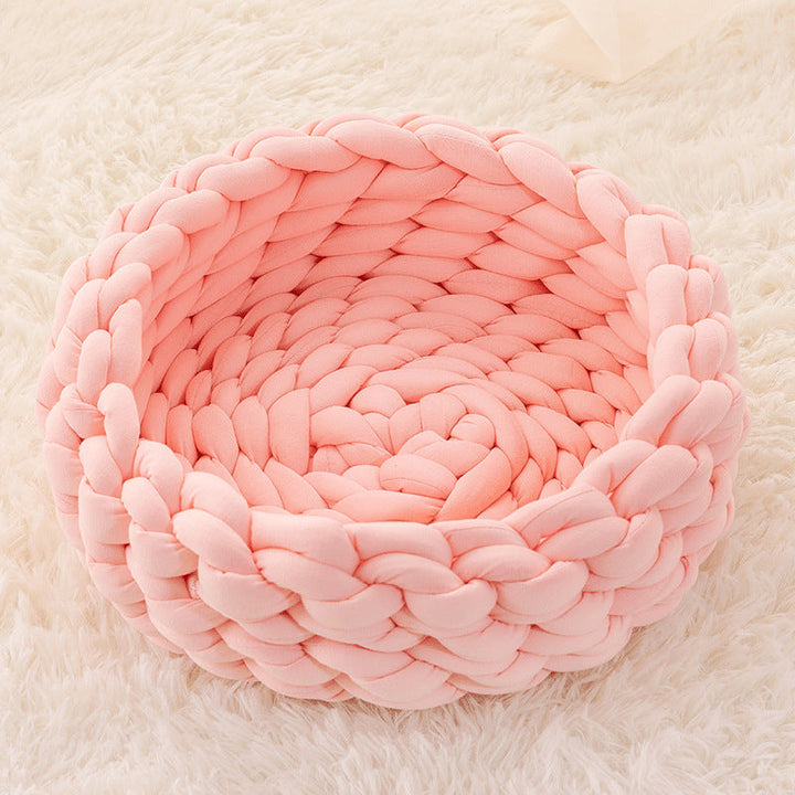 Your cat will love this plush, hand-woven basket for cozy naps.
