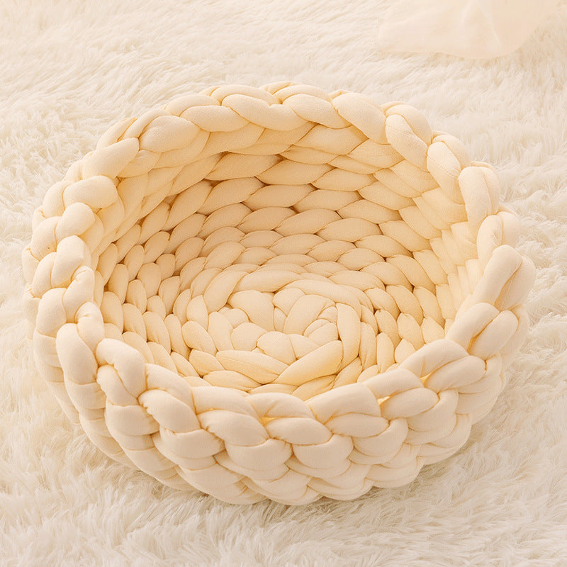 Aesthetic and practical hand-woven cat bed, designed for pet comfort.