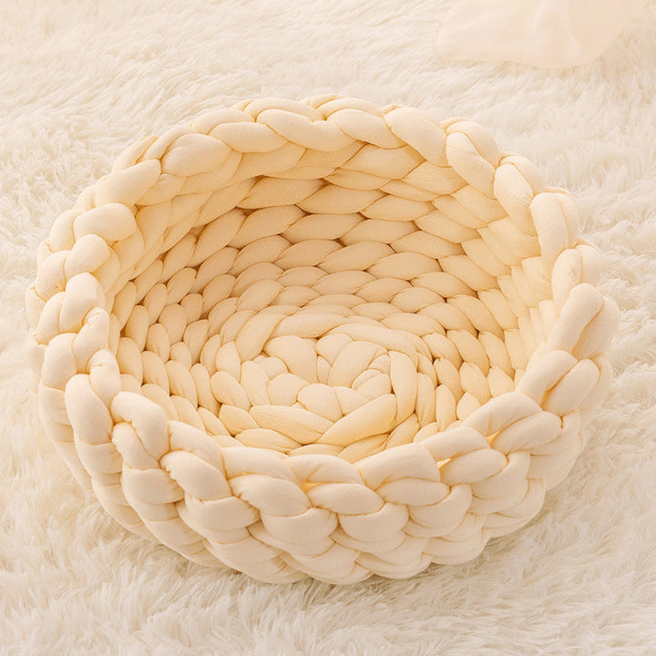 Aesthetic and practical hand-woven cat bed, designed for pet comfort.