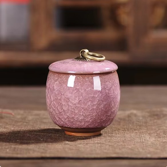 Modern ceramic pet urn with craquelé glaze, a tasteful way to display pet ashes at home.