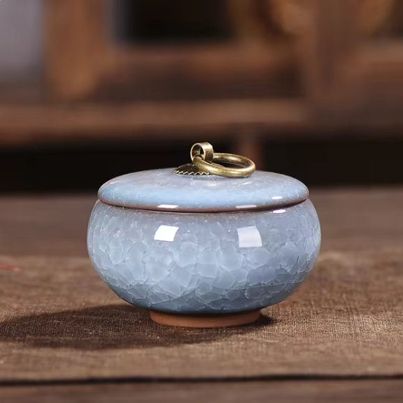 Serene handcrafted ceramic pet urn, craquelé glaze, a heartfelt memorial for beloved pets.