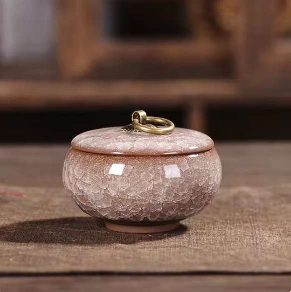 Textured ceramic pet urn with craquelé glaze, a personal and beautiful pet ashes keepsake.