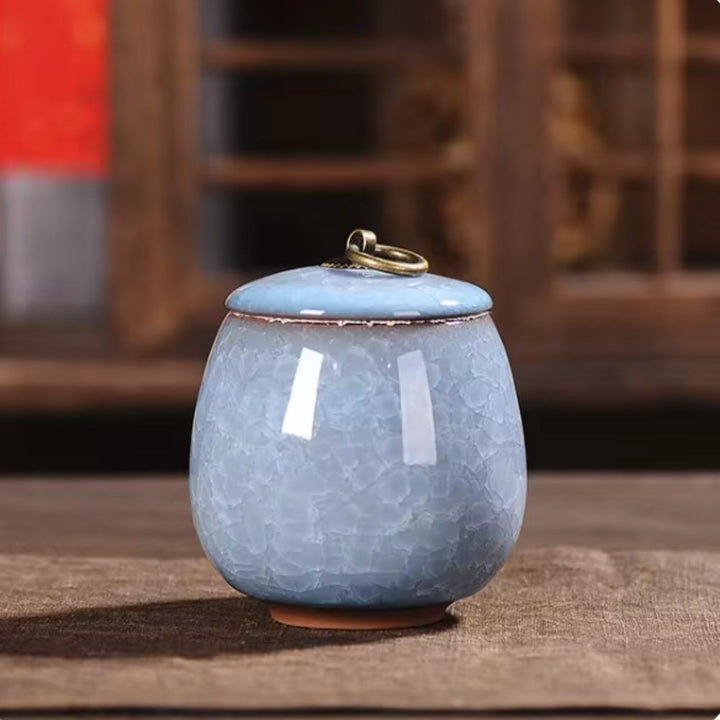 Artisan-crafted ceramic urn with crackle glaze, a dignified tribute for beloved pet's ashes.