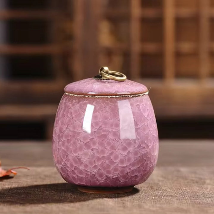 Unique ceramic pet urn featuring craquelé glaze, an elegant resting place for pet ashes.