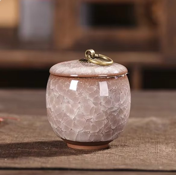 Keepsake pet urn, handcrafted ceramic, subtle craquelé glaze, for pet loss remembrance.