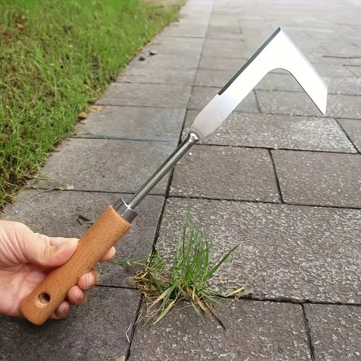 Close-up of efficient handheld stainless steel weed remover tool in action, clearing weeds from patio cracks.