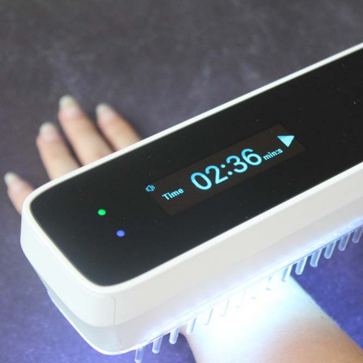 UVB narrow band light therapy lamp for psoriasis, vitiligo, & eczema relief. Handheld device for skin health.