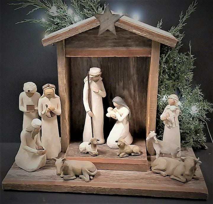 Close-up of the detailed figures in a handmade rustic wooden nativity set, perfect for holiday gifts